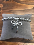 Silver Coloured Bracelet with Bow Charm